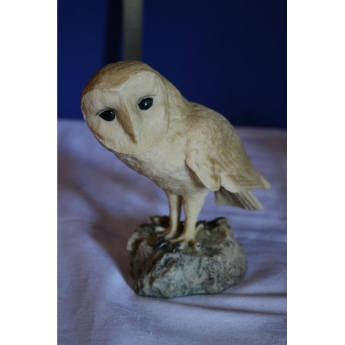 185 - Believed to be a Stone Cut Owl and an old Pair of Binoculars