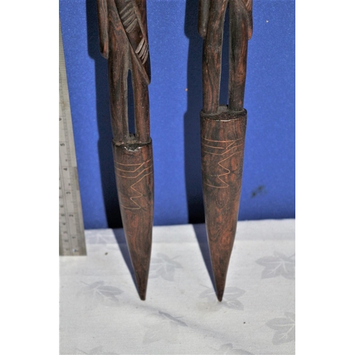 187 - Pair of African Hard Wood, Hand Carved Items in the Design of  Warriors. Both Have Copper Inlay