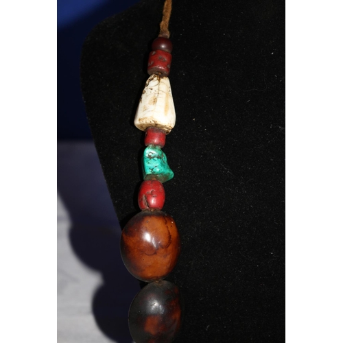 28 - Multi Stone Necklace with Tibetan Turquoise and a Large Round Copal Amber Centerpiece.