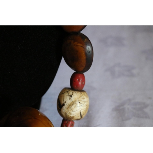 28 - Multi Stone Necklace with Tibetan Turquoise and a Large Round Copal Amber Centerpiece.