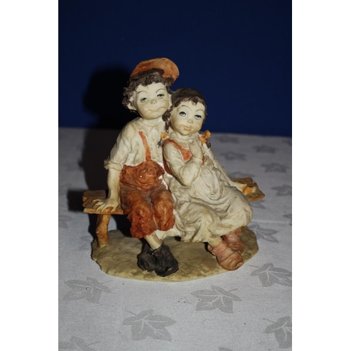 308 - Vintage Pottery Piece of two Children Seated on a Bench