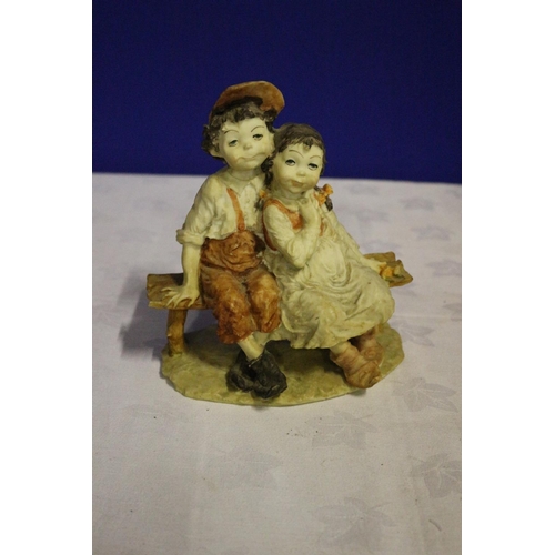 308 - Vintage Pottery Piece of two Children Seated on a Bench