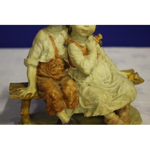 308 - Vintage Pottery Piece of two Children Seated on a Bench