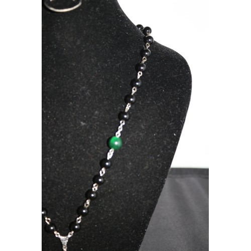 427 - A Green and Black Jade Cross Pendant Necklace