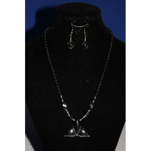 543 - A Modern Pendent Necklace with a Whales Tail Design and Matching Earrings - Main Colour is Graphite ... 