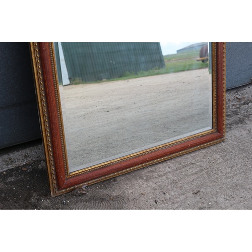 562 - Large Heavy Bevelled Glass Mirror in Ornate Surround. Very expensive when new.