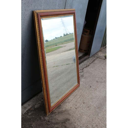 562 - Large Heavy Bevelled Glass Mirror in Ornate Surround. Very expensive when new.