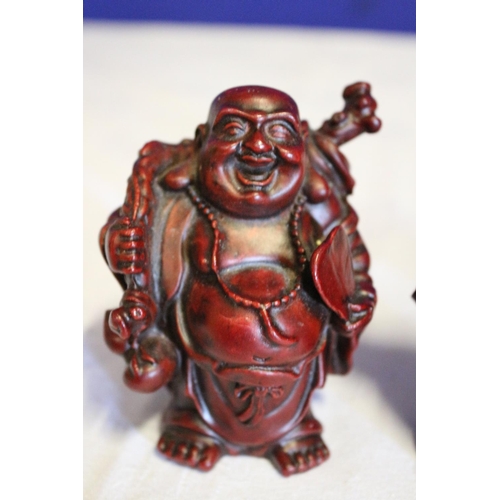 54 - Collection of 3 Small Composite Red Buddhas