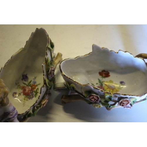 190 - Pair of Porcelain Cildren pushing Flower Covered Wheelbarrows - In the Style of Meissen