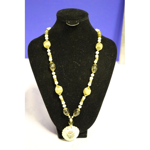 673 - Bone Pendant with Flower Decoration and Beaded Chain