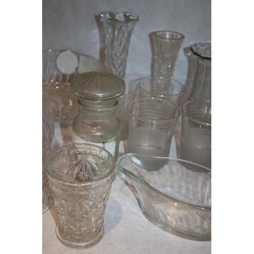 100 - A large assortment of clear glass including a paperweight