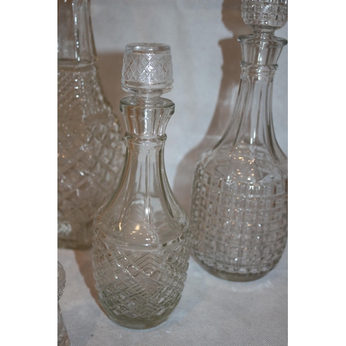 111 - 5 Cut Glass items including decanters and oil and vinegar dispensers