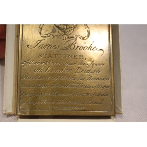 122 - Interesting heavy Brass advertising desk weight promoting James Brooker of London