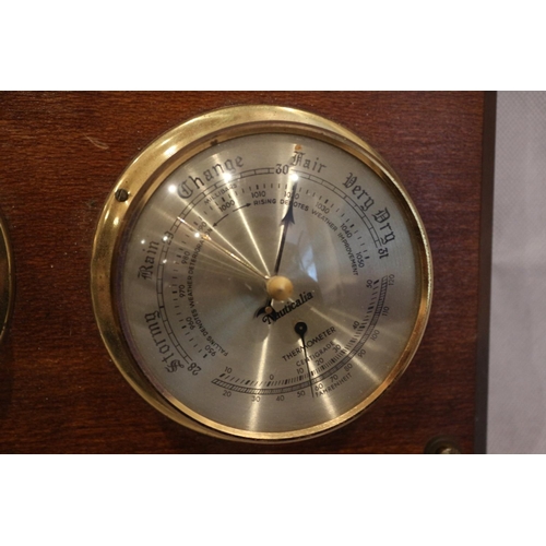 123 - Barometer and clock mounted on wood