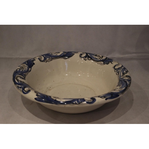 149 - Blue and White wash bowl with large ornate pitcher. Small chip on pitcher base