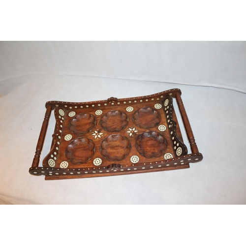 15 - Heavily embossed vintage twin handled wooden tray with what might be mother of pearl inlay