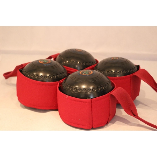 16 - Four Hemselite bowls in red carrier