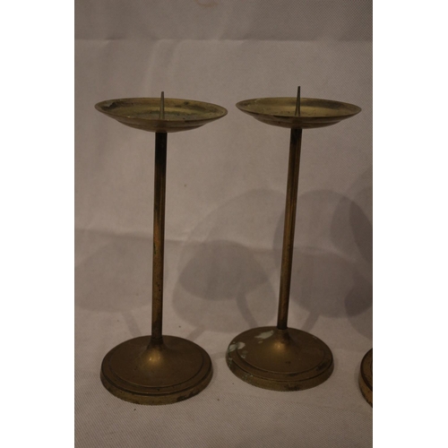 178 - 4 Brass candle stick holders, with 3 un-tested clocks