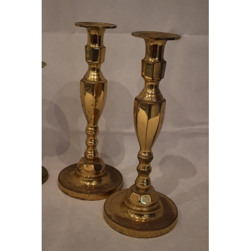 178 - 4 Brass candle stick holders, with 3 un-tested clocks