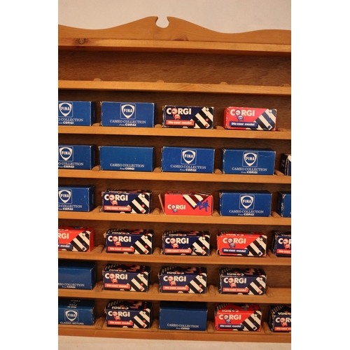 179 - A bespoke wooden cabinet containing 37 boxed diecast miniature Corgi vehicles