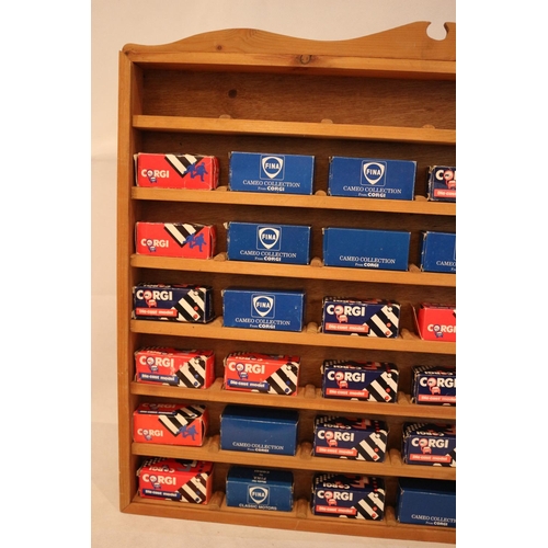 179 - A bespoke wooden cabinet containing 37 boxed diecast miniature Corgi vehicles