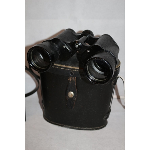 181 - 2 Pairs of Binoculars in cases, One by Tasco  20x50 and one by Tohoy of Japan 10x50