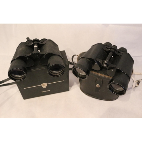 181 - 2 Pairs of Binoculars in cases, One by Tasco  20x50 and one by Tohoy of Japan 10x50