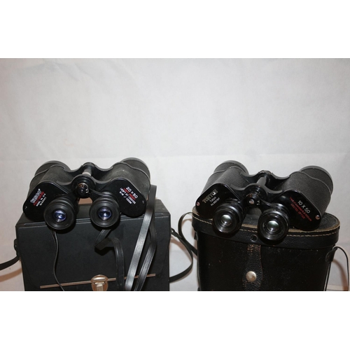 181 - 2 Pairs of Binoculars in cases, One by Tasco  20x50 and one by Tohoy of Japan 10x50