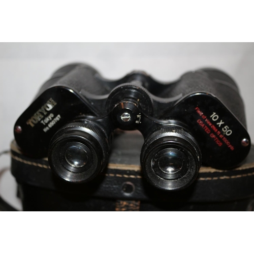 181 - 2 Pairs of Binoculars in cases, One by Tasco  20x50 and one by Tohoy of Japan 10x50