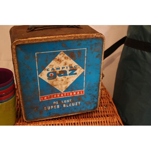 185 - Camping equipment including vintage gas stove un-tested, Juniper 3 tent, wicker basket and plastic c... 