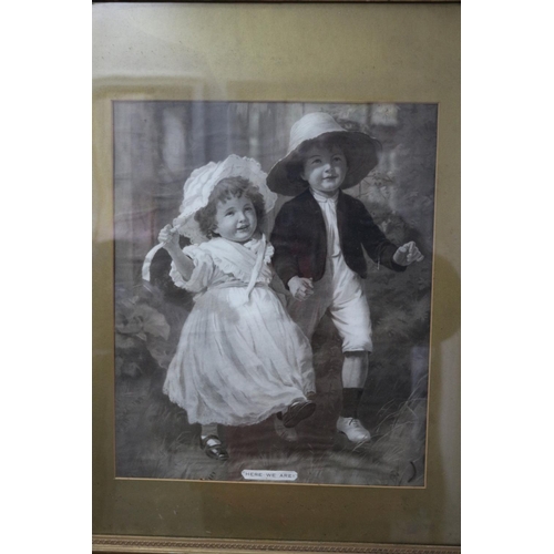 192 - A cute print, with good age, of two young children, complete with frame which is marked John Dewar &... 