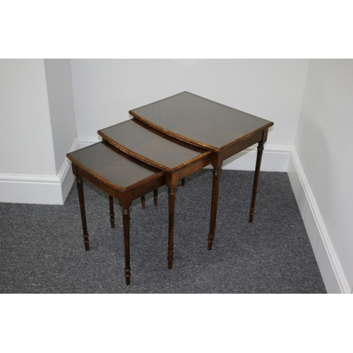 193 - Nest of three wooden tables with glass tops