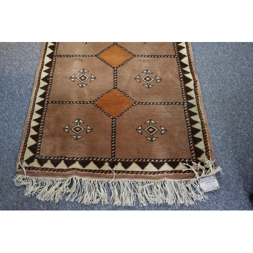 195 - Lovely large runner rug from Bucharest, 10ft 6ins x 3ft 4ins. still with original label