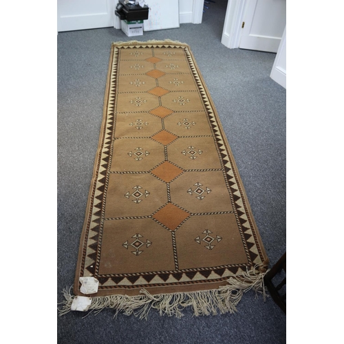 195 - Lovely large runner rug from Bucharest, 10ft 6ins x 3ft 4ins. still with original label