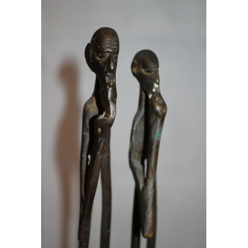 221 - Heavy metal sculpture of African couple