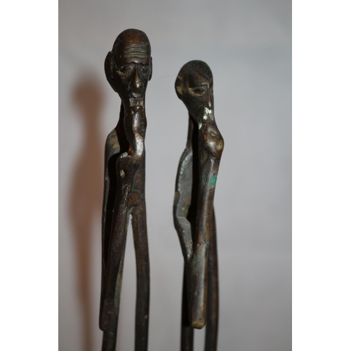 221 - Heavy metal sculpture of African couple