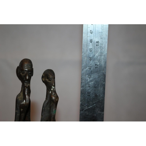 221 - Heavy metal sculpture of African couple