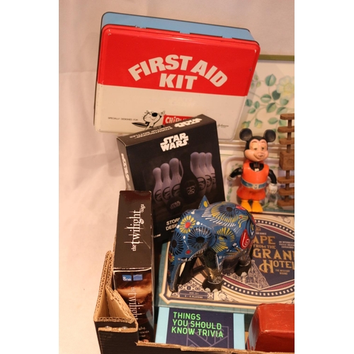 52 - A box of interesting items including a vintage Mickey Mouse, Blue Elephant, Games, Trays, Dvd and mo... 