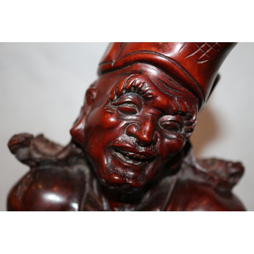 80 - Hand carved believed to be Chinese hardwood statue with begging bowl