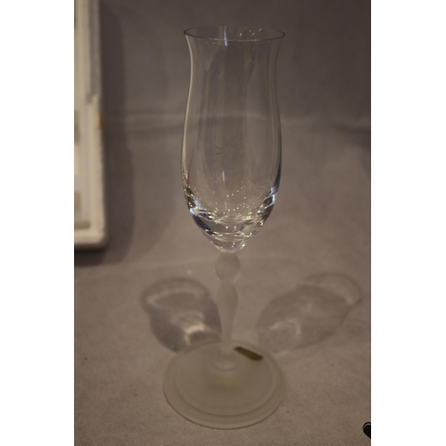 85 - 6 Inn Crystal wine glasses with 5 matching coasters. Glasses marked 1886 - 1986. Two rims slightly c... 