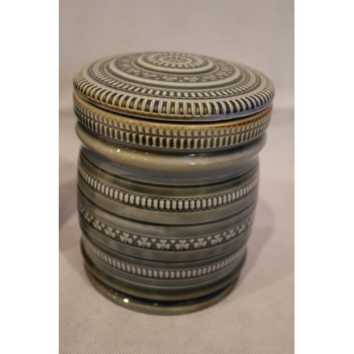 86 - 2 Irish Porcelain Lidded Jars. Stamped on the bottom. Twist lock lids