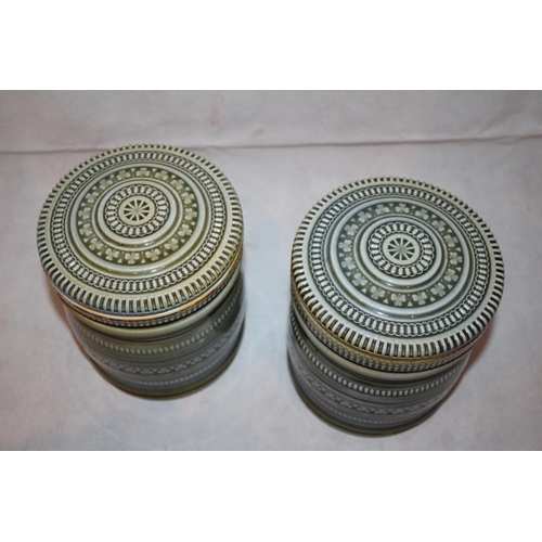 86 - 2 Irish Porcelain Lidded Jars. Stamped on the bottom. Twist lock lids