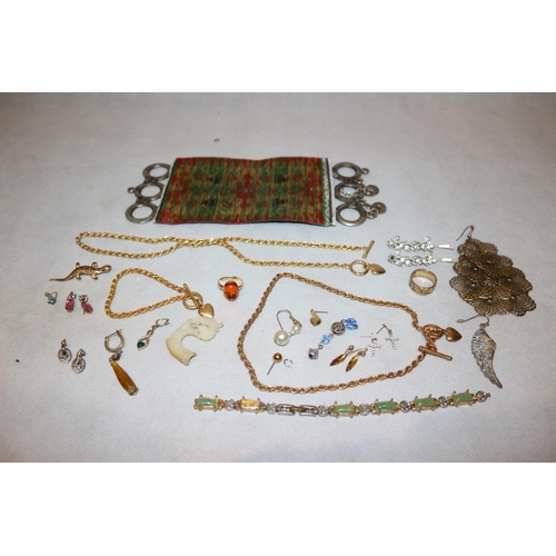 411 - A selection of costume jewellery including Rings, Chains and earrings plus an unusual believed to be... 