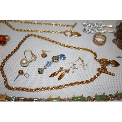 411 - A selection of costume jewellery including Rings, Chains and earrings plus an unusual believed to be... 