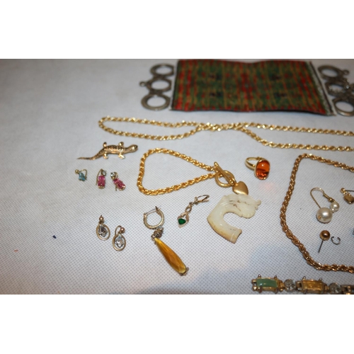 411 - A selection of costume jewellery including Rings, Chains and earrings plus an unusual believed to be... 