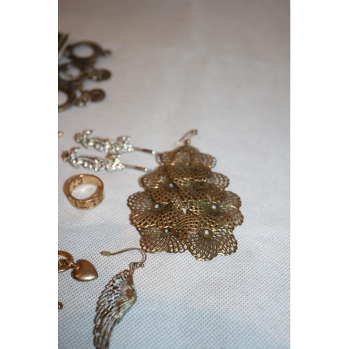 411 - A selection of costume jewellery including Rings, Chains and earrings plus an unusual believed to be... 