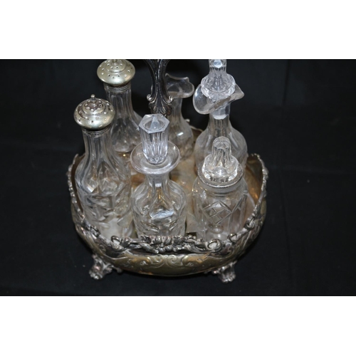 104 - A Nice Ornate Plate ware Condiment Set, One jar missing a stopper