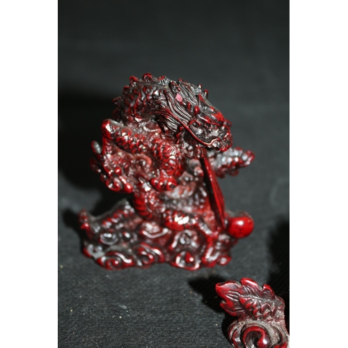 117 - A Collection Of 5 Red Composite Dragons All Holding Pearl Of Wisdom