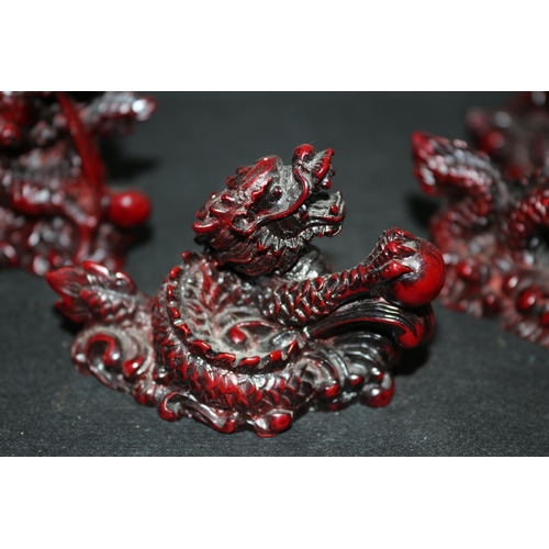 117 - A Collection Of 5 Red Composite Dragons All Holding Pearl Of Wisdom