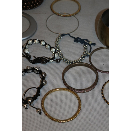 50 - An assortment of Costume Jewellery Bangles